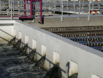 Water flows through openings of clarifier lined with Mainstay Composite Liner