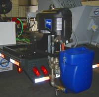 Xtreme airless spray pump mounted on sliding cart on trailer